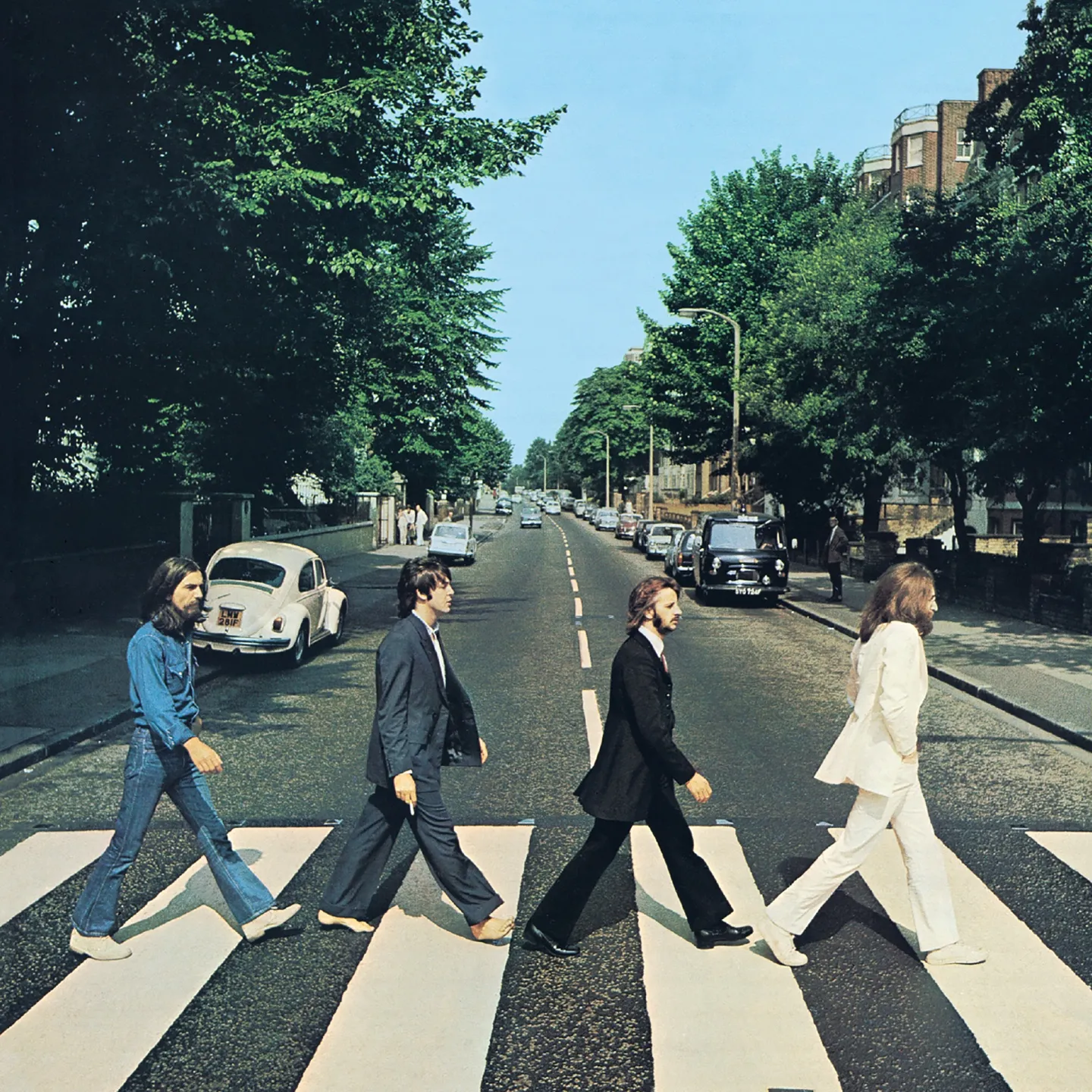 The Beatles walking across the zebra crossing on Abbey Road
